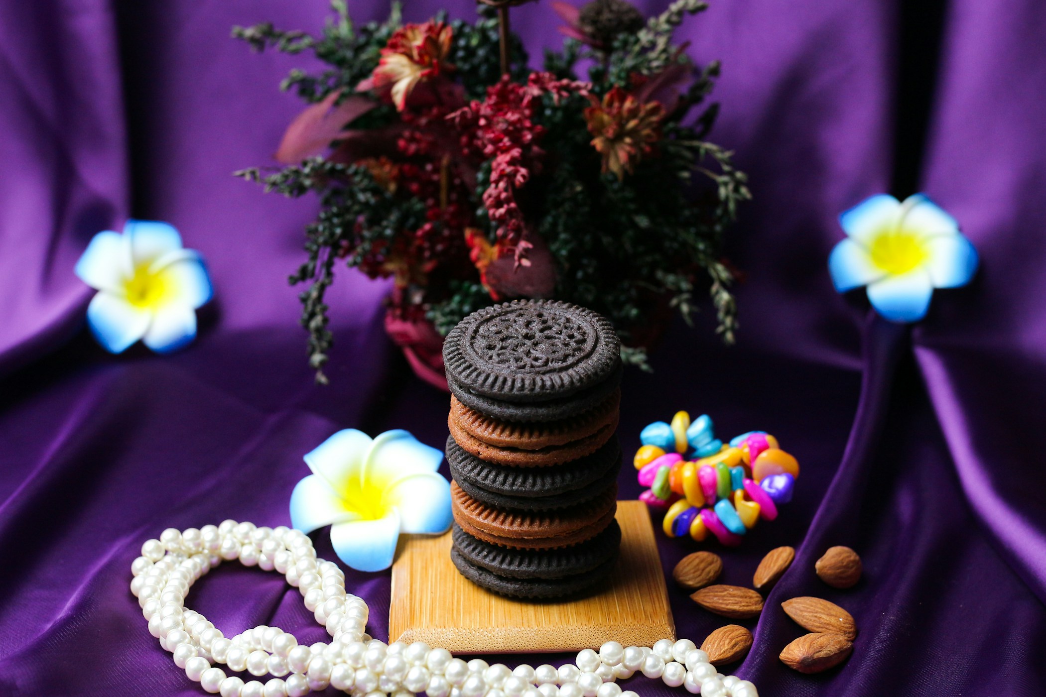 Delicious cookies and nuts with flowers