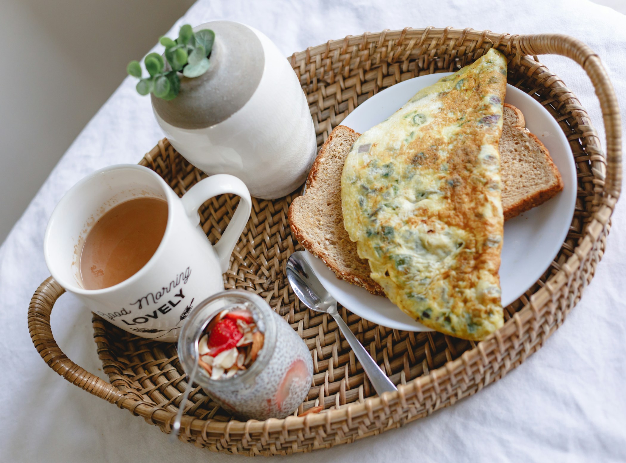 A casual breakfast setup with omelet and chia pudding