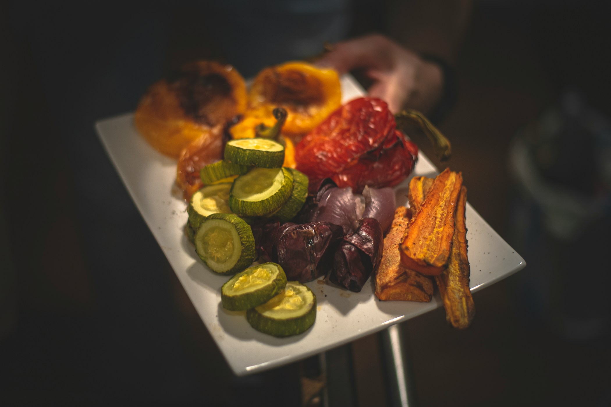 Vegetables baked in the oven — sweet peppers, carrots, onions and zucchini.